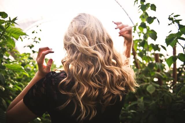 woman with curly balayage colour