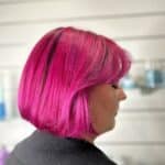 Side View Of Woman With A Hot Pink Bob