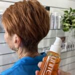 Copper Pixie Cut And A Bottle Of Hair Oil