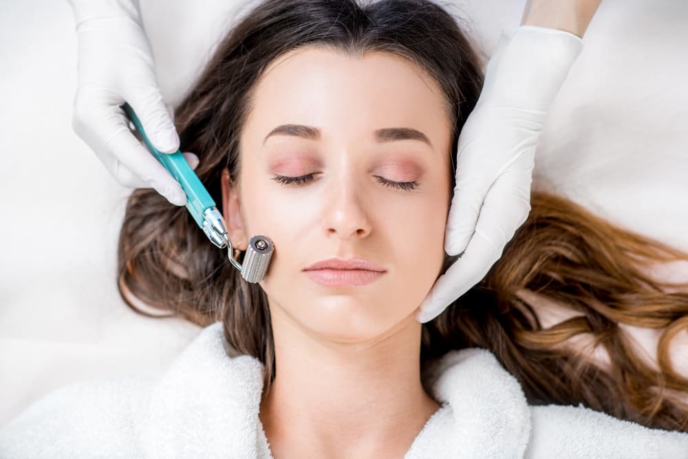 Making Dry Needlying Procedure On Woman's Face In The Cosmetology Office — Strut Hair & Beauty in Maroochydore, QLD